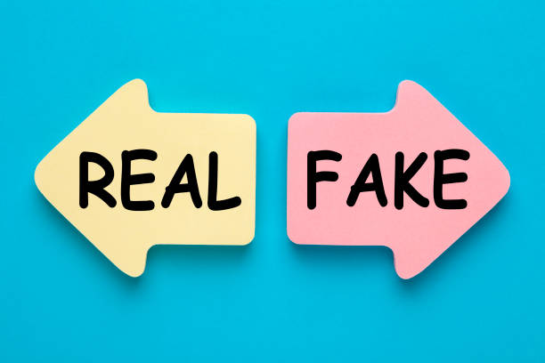 fake or real written in paper arrows on blue background. business concept.